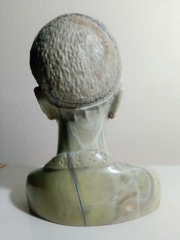 A exquisitely hand carved Jade green African bust by artist Willis Nxumalo from KZN in RSA.   1.1Kgs