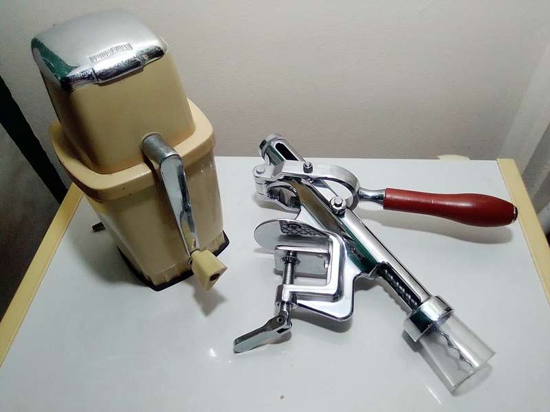 A manual working "Swing-A-Way" Ice crusher plus a table mounted Large wine bottle Cork puller.