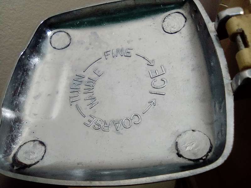 A manual working "Swing-A-Way" Ice crusher plus a table mounted Large wine bottle Cork puller.