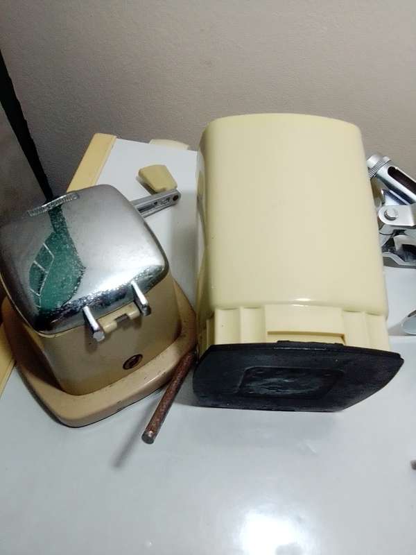 A manual working "Swing-A-Way" Ice crusher plus a table mounted Large wine bottle Cork puller.