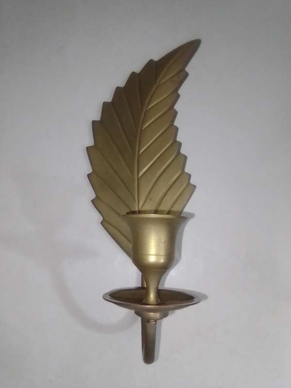 Ebay 495$. 197o's Leaf Shaped Candle Wall Sconce Solid heavy Brass 1970s. Great for home wall Decor.