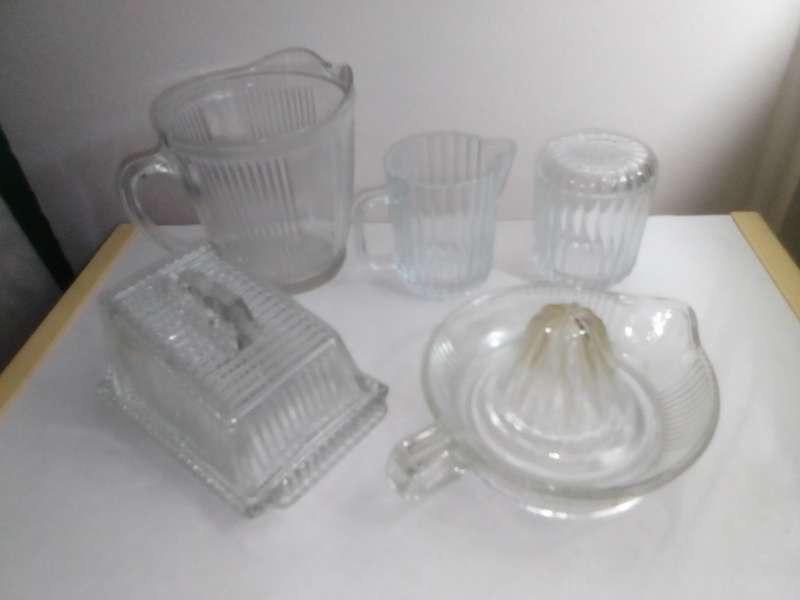 5 clean vintage glass kitchen Glass sets. 2 Water Jugs, Lidded Jar, Butter Dish. Lemon Squeeze.