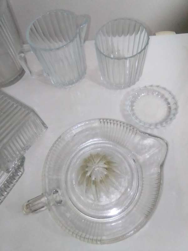 5 clean vintage glass kitchen Glass sets. 2 Water Jugs, Lidded Jar, Butter Dish. Lemon Squeeze.