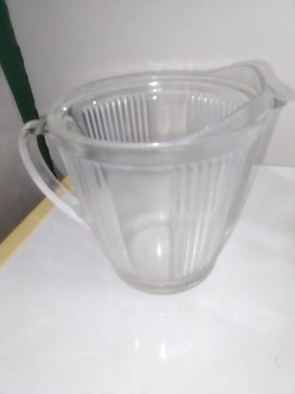 5 clean vintage glass kitchen Glass sets. 2 Water Jugs, Lidded Jar, Butter Dish. Lemon Squeeze.