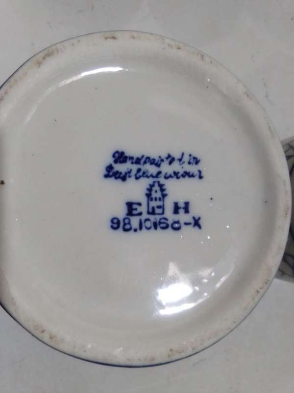 8 x Blue and White items. Delft blue Hand painted Candlestick. Bell with striker. 4 Soike cups.