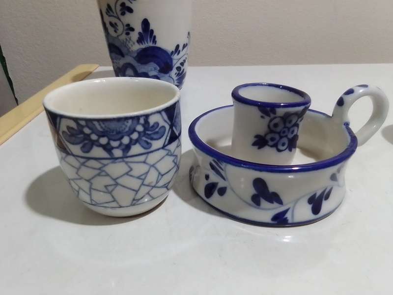 8 x Blue and White items. Delft blue Hand painted Candlestick. Bell with striker. 4 Soike cups.