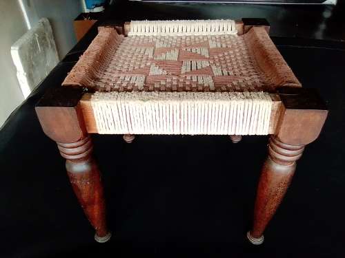 A very old ethnic hand woven seat in good condition for its age. Size 29cm x 31cm.