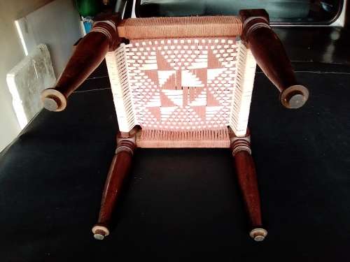 A very old ethnic hand woven seat in good condition for its age. Size 29cm x 31cm.