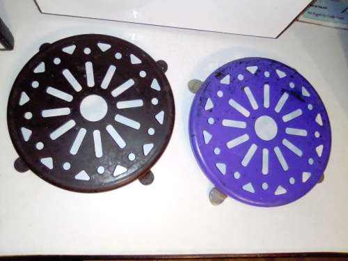 Three old Kitchen Trivets.Two enamel blue plus White and the other brown metal.In good condition.