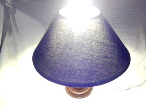 A working wood and Brass table lamp. Size: 35.5cm Tall and is in excellent used condition.