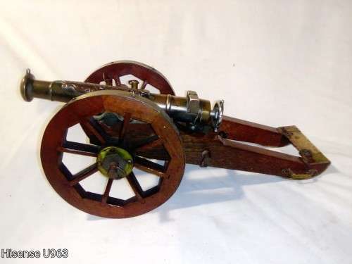 Belonged to a Sea Captain a bronze barrel Dragon motif Canon. It has a Hight adjusting wheel.