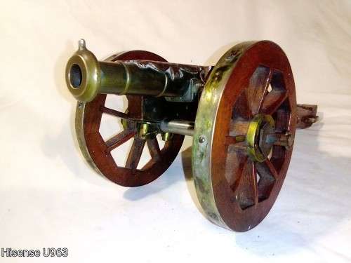Belonged to a Sea Captain a bronze barrel Dragon motif Canon. It has a Hight adjusting wheel.