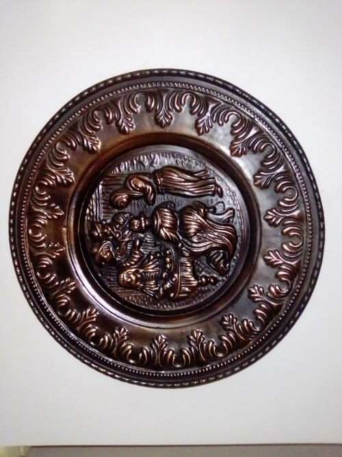 A Medieaval Tavern scene wall plate with a lot of caritor. Lovely Decor.