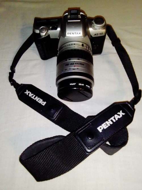 A Pentax AZ50 with 28-80mm lens in carry bag. In fair used condition.
