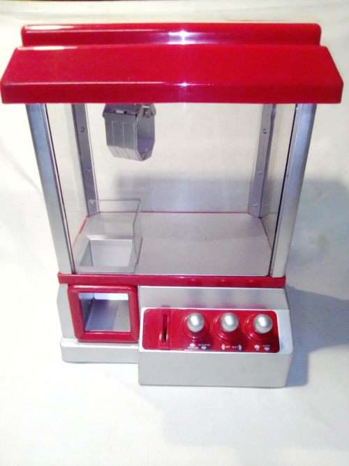 A `Toy Grab Machine` been in storage a long time bu still in good condition for age.