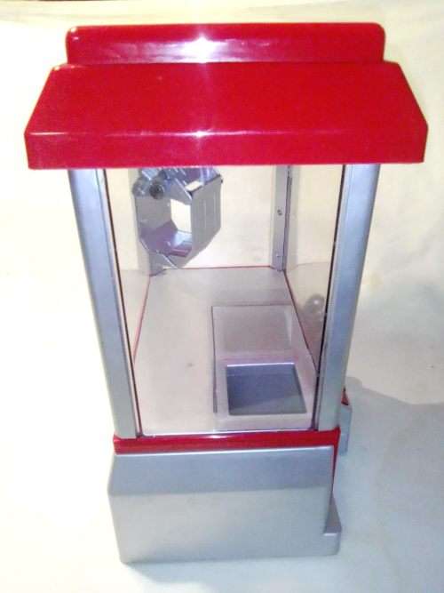A `Toy Grab Machine` been in storage a long time bu still in good condition for age.