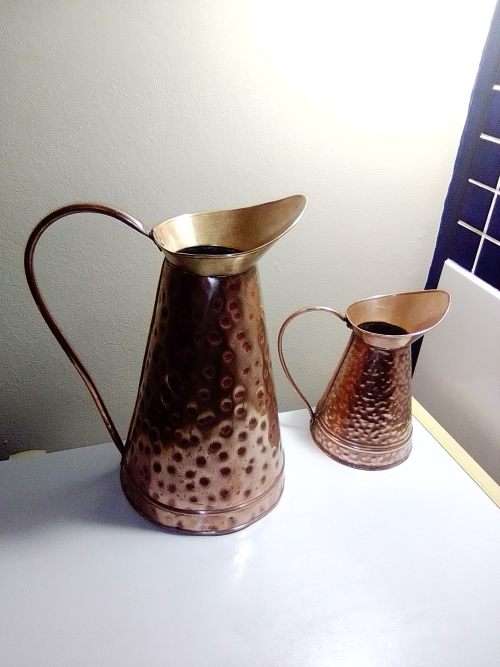 Two old vintage hand beaten copper Jug`s and in good shape. In good condition.
