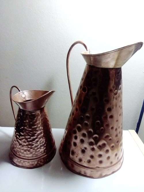 Two old vintage hand beaten copper Jug`s and in good shape. In good condition.