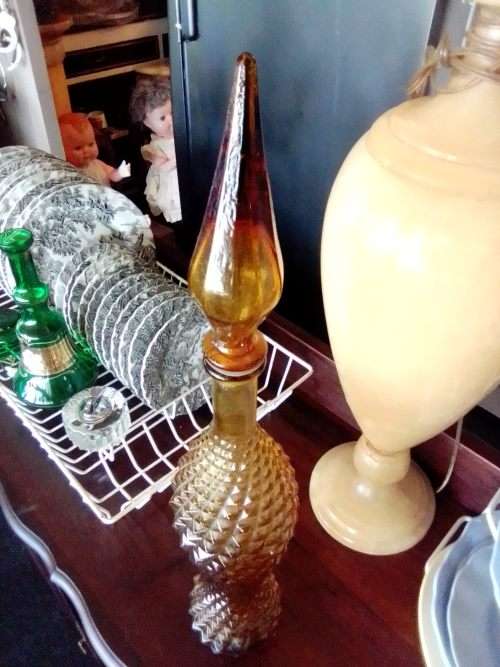 A rare old 58cm tall Amber studio glass Geni bottle in good used second hand condition.