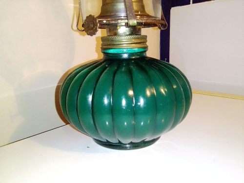 A Hunters green kerosene lamp with mantel. Made by Lamp light farms USA.