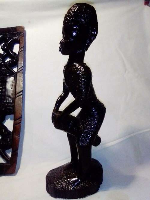 Rare African Trible art wooden wall merual carving from the Ivory Coast and a Drummer Statue.