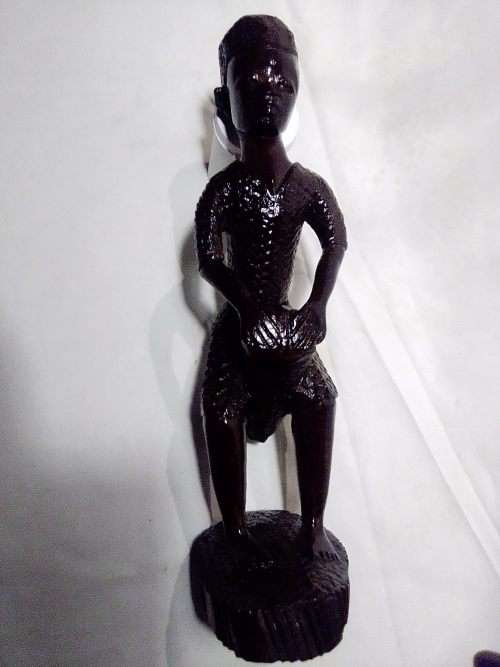 Rare African Trible art wooden wall merual carving from the Ivory Coast and a Drummer Statue.