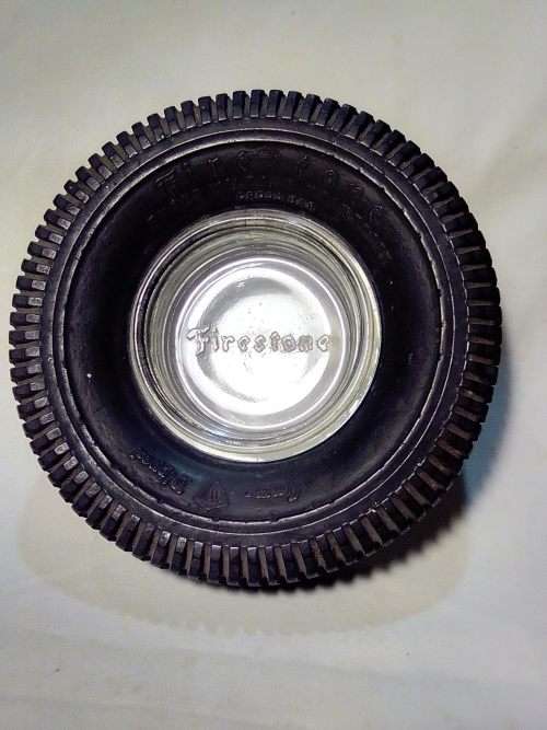 A Old Firestone tyre ashtray. In good condition for it`s age