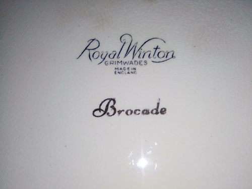Grimwades `Royal Winton` Iridescent Gold Gilded rim wall plate green flower paton.