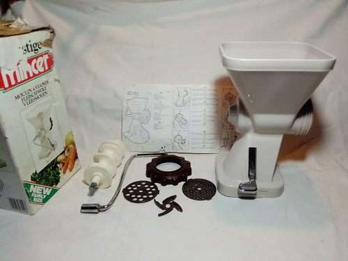 In Good working order. Original box. Prestage Mincer made in ITALY. hand driven, table suction.