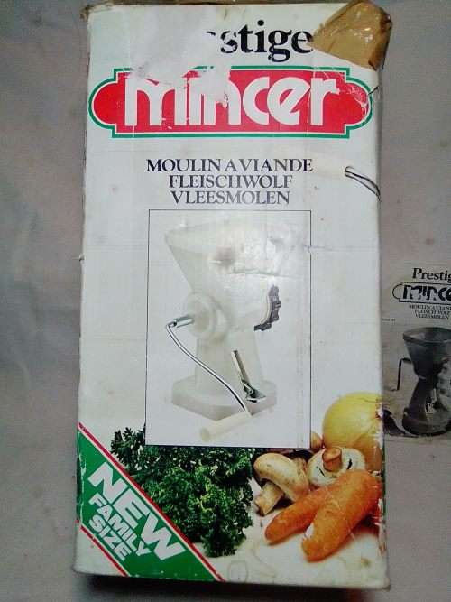 In Good working order. Original box. Prestage Mincer made in ITALY. hand driven, table suction.