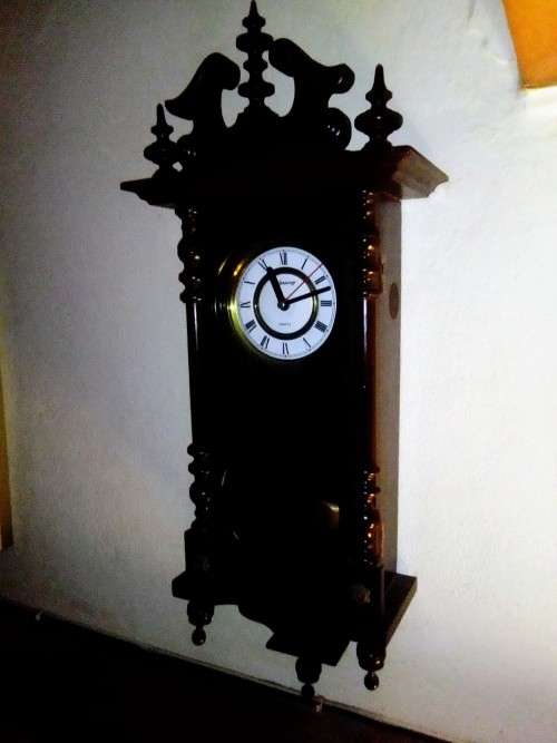 A clean dark wood working Quarts `Blessing` Wall Clock. In good condition.
