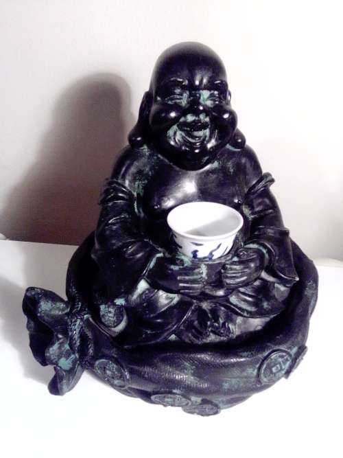 Large Green Buda with (We Think) ceramic?  bowl sitting on a money bag. In good condition.