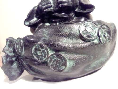 Large Green Buda with (We Think) ceramic?  bowl sitting on a money bag. In good condition.