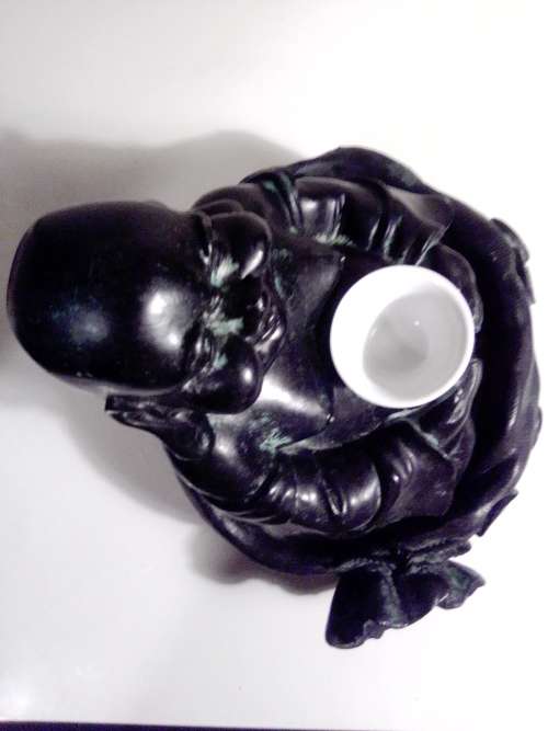 Large Green Buda with (We Think) ceramic?  bowl sitting on a money bag. In good condition.