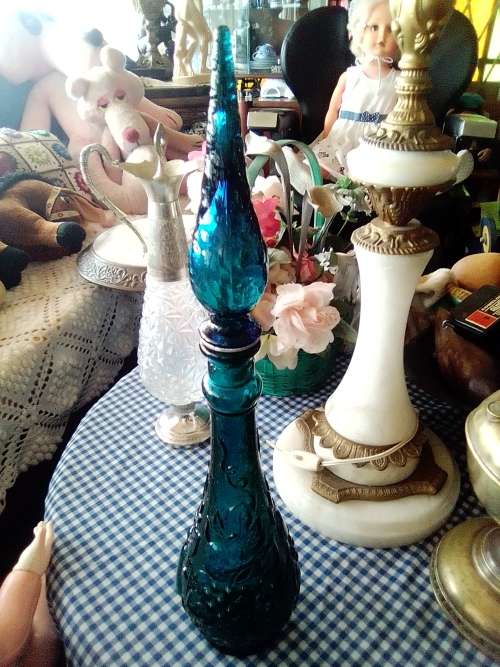 A Very Rare & Scarce. This large Teal Blue Genie bottle with embossed fruit motif is 480mm Tall.