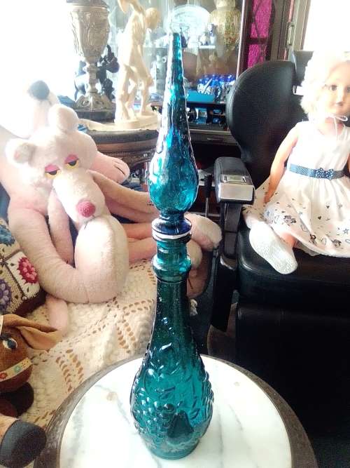 A Very Rare & Scarce. This large Teal Blue Genie bottle with embossed fruit motif is 480mm Tall.