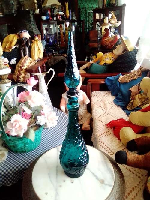 A Very Rare & Scarce. This large Teal Blue Genie bottle with embossed fruit motif is 480mm Tall.