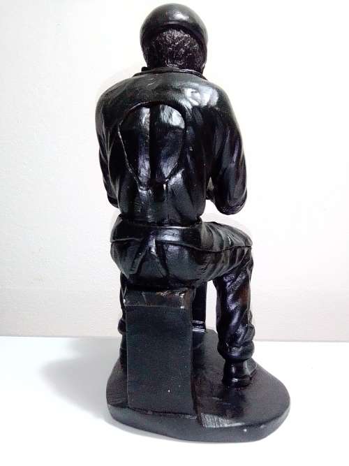 A Very heavy signed By `E. Chiwaridzo` an Ethnic worker, Cobler with hammer and all. 25cm Tall