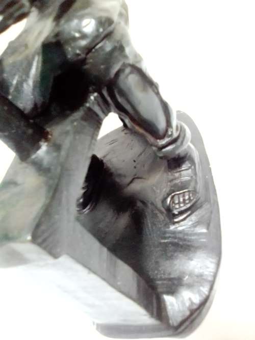 A Very heavy signed By `E. Chiwaridzo` an Ethnic worker, Cobler with hammer and all. 25cm Tall