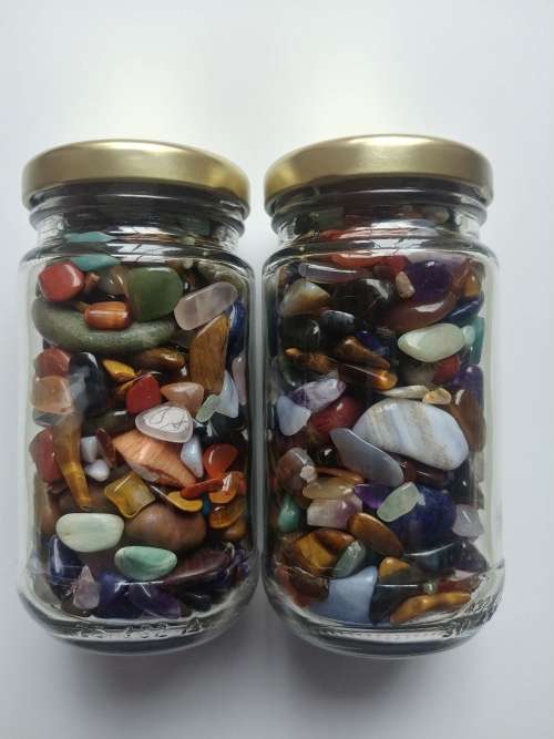 2 x bottles full of small gemstones