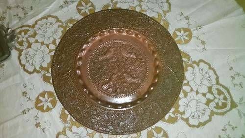 beautiful copper look plate with intricate pattern
