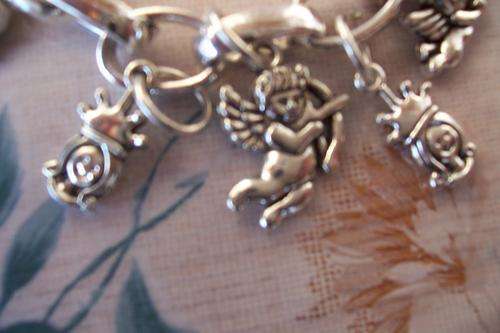 Lovely Tibetian silver charm bracelet with angels, cupid and queens