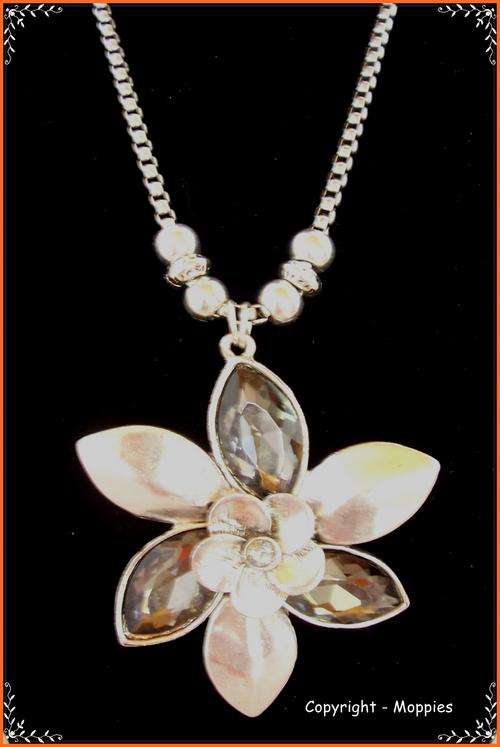 Tibetian silver flower pendant and chain with black crystal