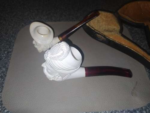Unknown `carved face` smoking pipes