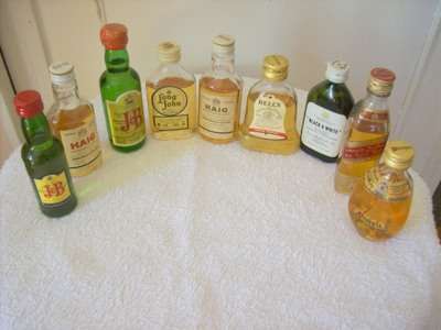 COLLECTION OF MINATURE WHISKEY BOTTLES