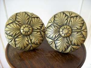 A PAIR OF CURTAIN TIE BACKS