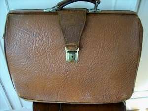 AN OLD LEATHER BRIEFCASE