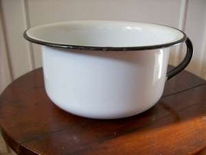 AN OLD ENAMEL POTTIE