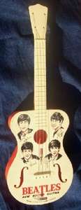 A VINTAGE BEATLES PLASTIC GUITAR BY  SELCOL
