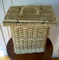 A WICKER BASKET WINE HOLDER